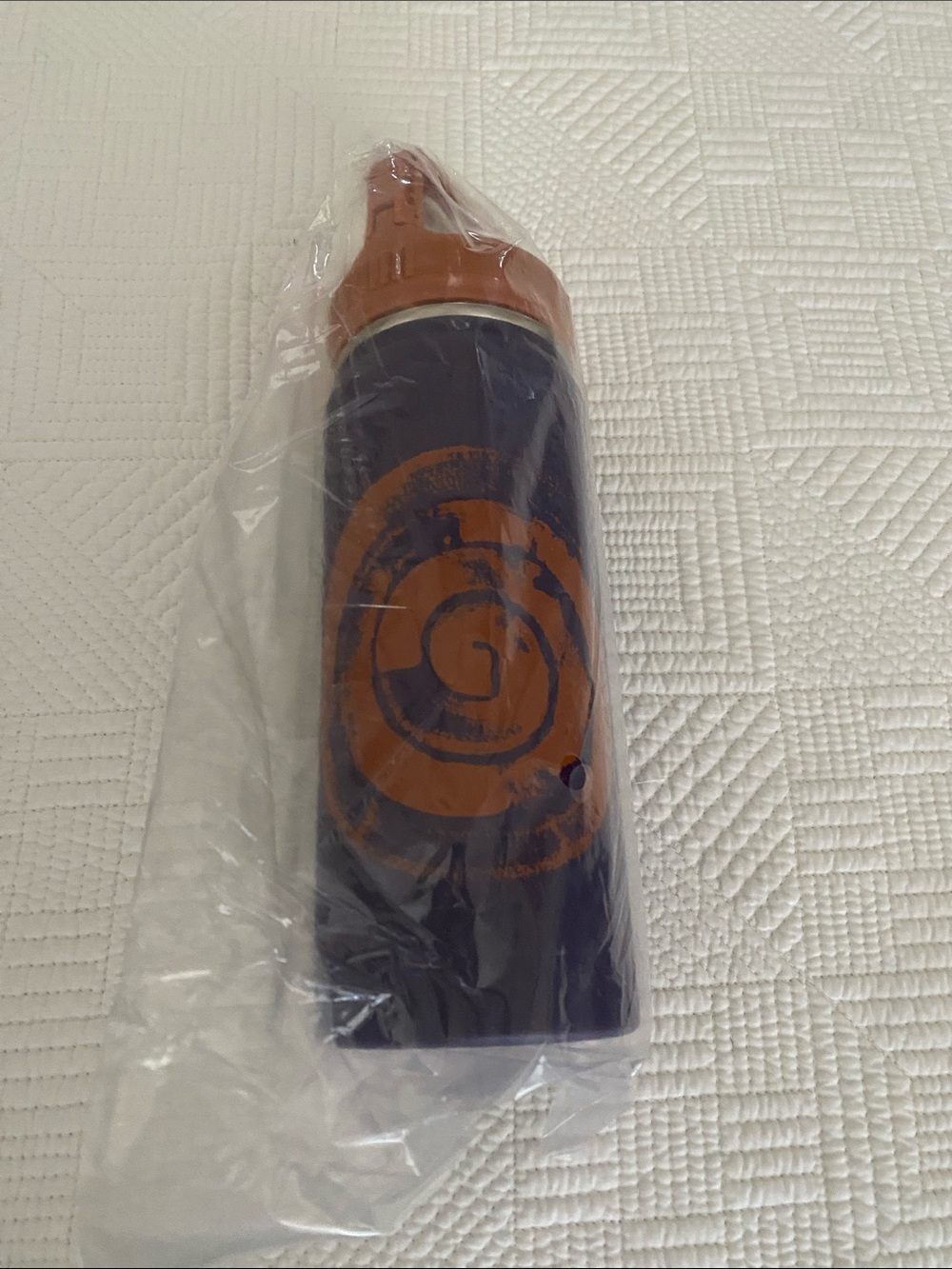 Teva navy blue and burnt orange water bottle